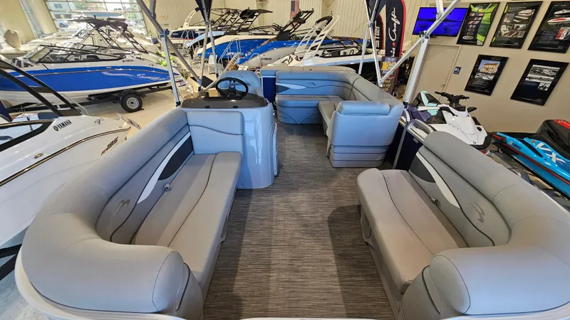 Slide: The Image of 2020 Bennington 188 SV pontoon boat interior with gray seating in showroom. - 7