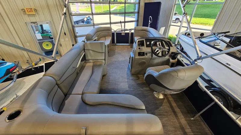 Slide: The Image of 2020 Bennington 188 SV pontoon boat interior with plush seating and modern helm. - 8