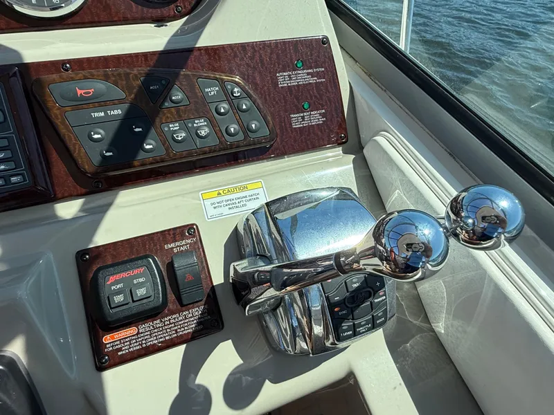 Slide: The Image of Control panel of 2012 Sea Ray 370 Sundancer boat with throttle and switches. - 18