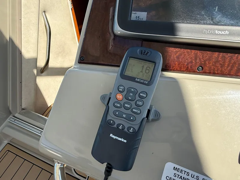 Slide: The Image of Raymarine VHF radio on 2012 Sea Ray 370 Sundancer yacht dashboard. - 20