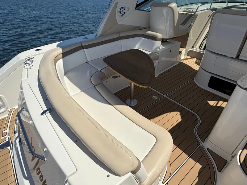 Slide: The Image of 2012 Sea Ray 370 Sundancer yacht with spacious seating and elegant wooden deck. - 21
