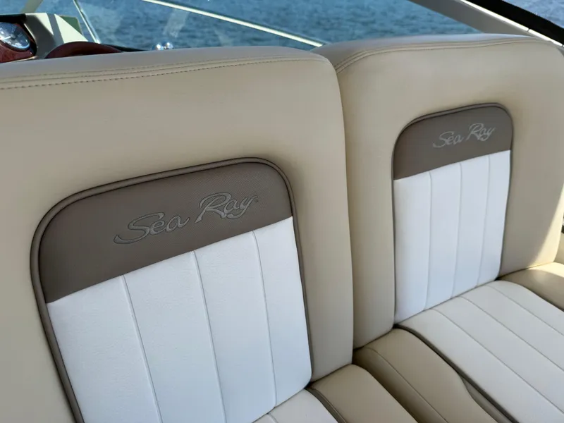 Slide: The Image of Luxury seating on 2012 Sea Ray 370 Sundancer boat, featuring elegant beige and white upholstery. - 25