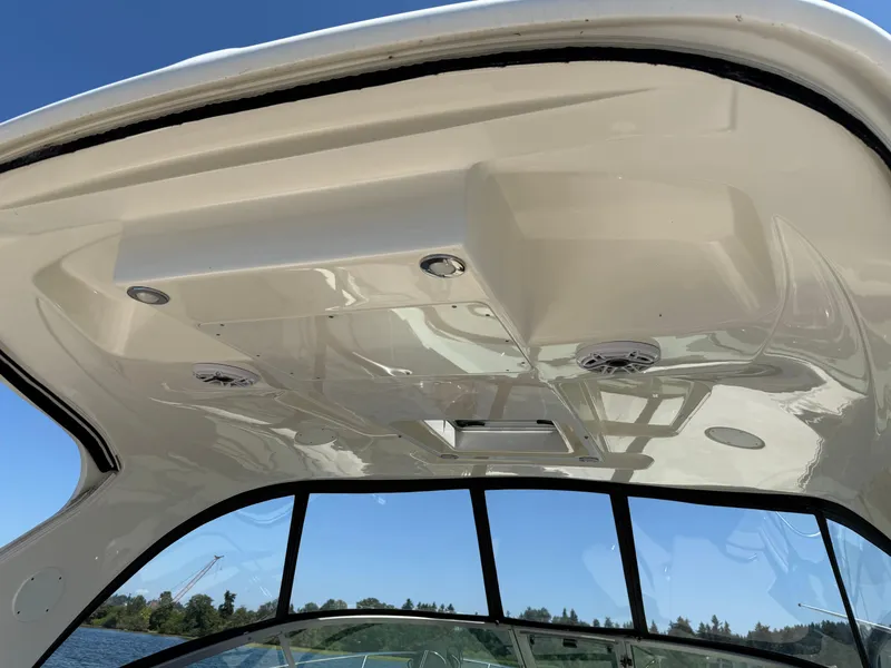 Slide: The Image of 2012 Sea Ray 370 Sundancer boat interior ceiling with speakers and lights. - 33