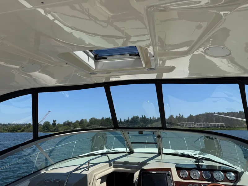 Slide: The Image of Interior view of 2012 Sea Ray 370 Sundancer boat with scenic water backdrop. - 34