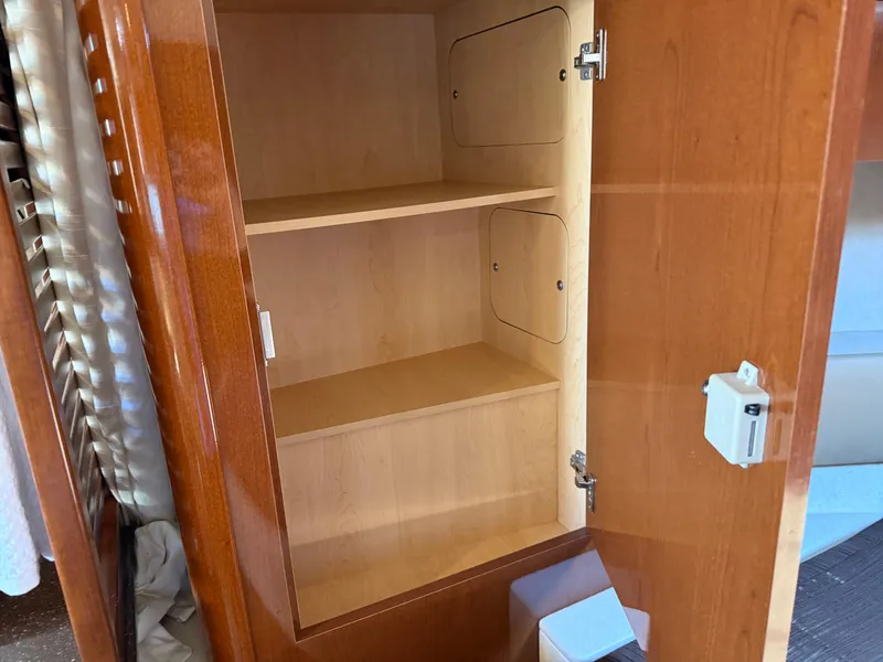 Slide: The Image of Empty wooden cabinet inside 2012 Sea Ray 370 Sundancer yacht. - 40