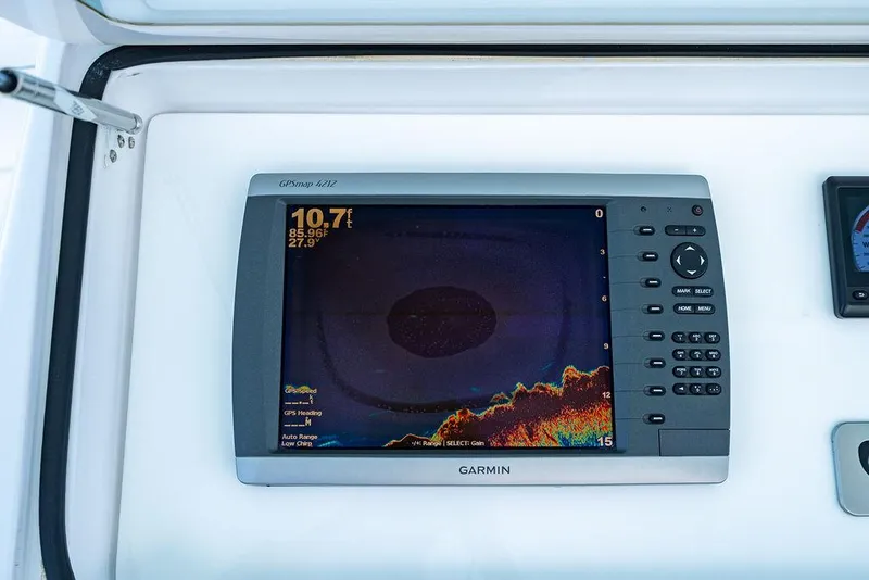 Slide: The Image of Garmin GPSmap 4212 display on 1999 Viking Convertible boat dashboard. - 19