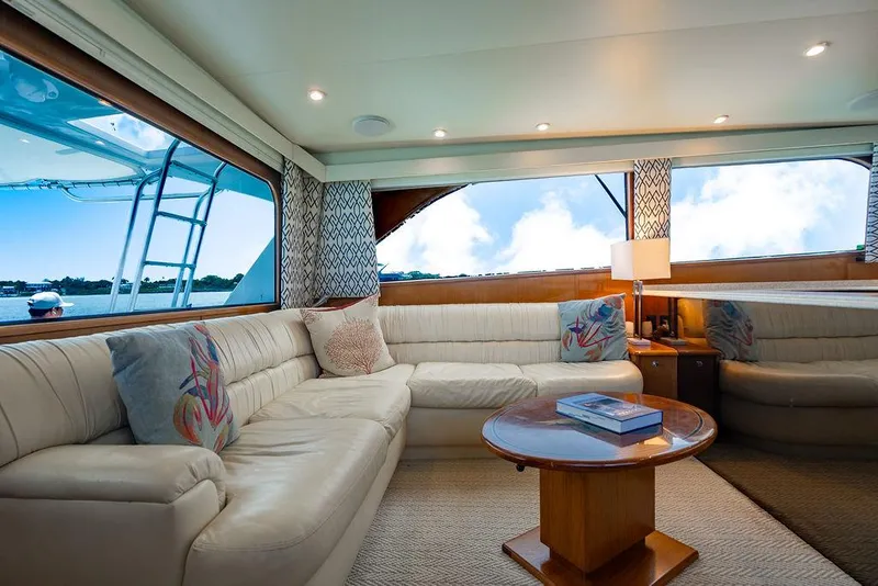 Slide: The Image of Luxurious interior of a 1999 Viking Convertible yacht with plush seating and scenic windows. - 40