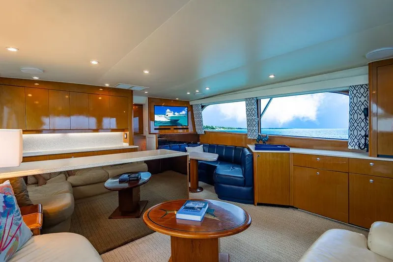 Slide: The Image of Luxurious interior of a 1999 Viking Convertible yacht with ocean view and elegant furnishings. - 43