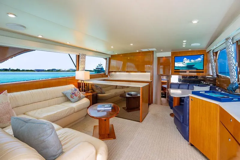 Slide: The Image of Luxurious interior of a 1999 Viking Convertible yacht with plush seating and ocean view. - 45