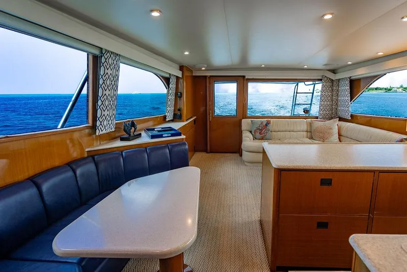 Slide: The Image of Luxurious interior of a 1999 Viking Convertible yacht with ocean view and elegant seating. - 46