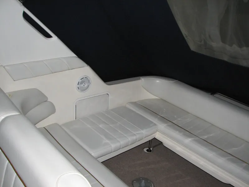 Slide: The Image of 1998 Sea Ray 330 Sundancer interior with white seating and modern design. - 7
