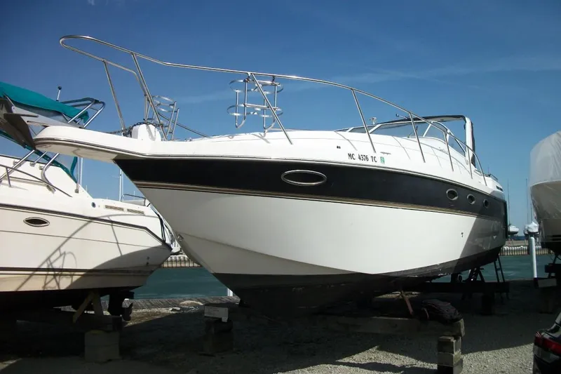 Slide: The Image of 2001 Thompson 3400 Santa Cruz boat on dry dock under clear blue sky. - 2