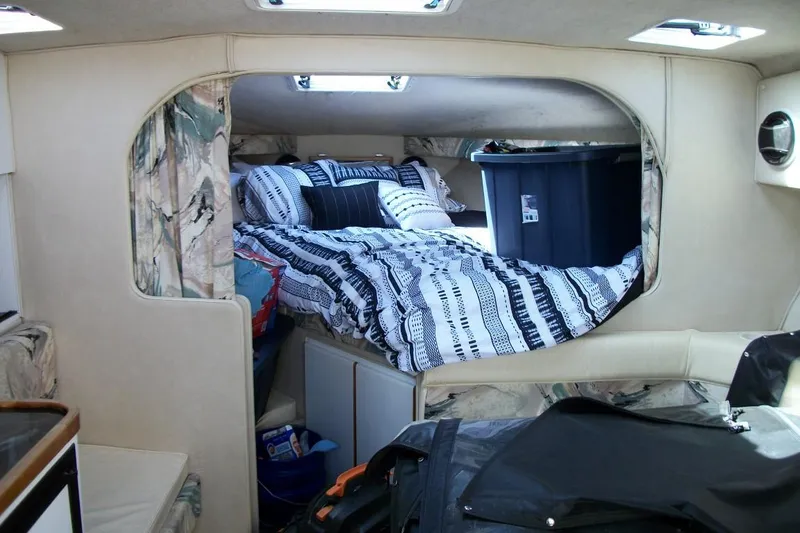 Slide: The Image of Interior of 2001 Thompson 3400 Santa Cruz boat with cozy cabin and bed. - 5