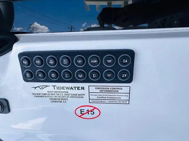 Slide: The Image of Control panel of 2026 Tidewater 302 CC Adventure boat with emission information. - 5