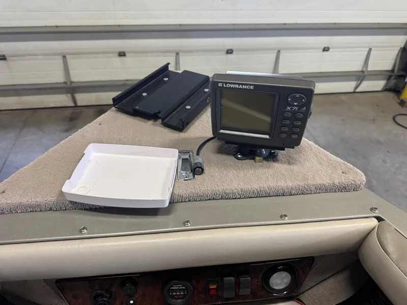 Slide: The Image of Lowrance X71 fish finder on 2002 Lund 1850 Tyee Gran Sport boat dashboard. - 14