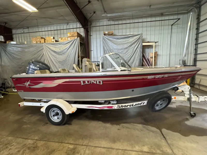 Slide: The Image of 2002 Lund 1850 Tyee Gran Sport boat in a garage, on a ShoreLand'r trailer. - 3