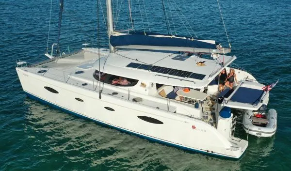 The Image of 2008 Fountaine Pajot Salina 48 catamaran sailing on clear blue water. - 1