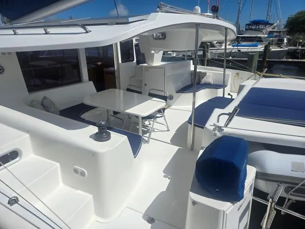Slide: The Image of 2008 Fountaine Pajot Salina 48 catamaran with spacious outdoor seating and dining area. - 18