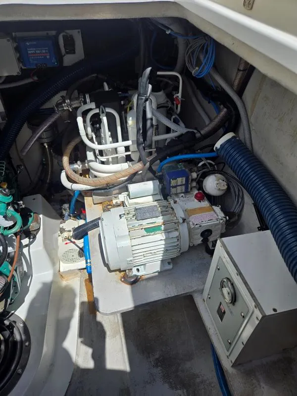 Slide: The Image of Engine room of 2008 Fountaine Pajot Salina 48 catamaran, showcasing mechanical components and wiring. - 31