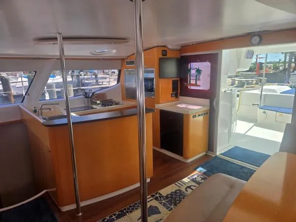 Slide: The Image of Interior of 2008 Fountaine Pajot Salina 48 catamaran with modern kitchen and seating area. - 4