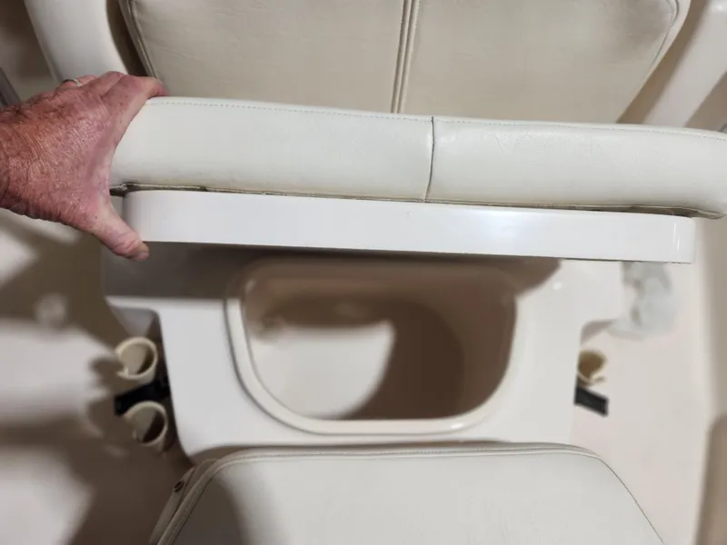 Slide: The Image of Boat seat detail on 2015 Grady-White 191 Coastal Explorer, featuring white upholstery and cup holders. - 10