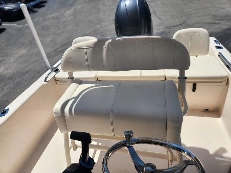 Slide: The Image of 2015 Grady-White 191 Coastal Explorer boat interior with steering wheel and seating. - 14