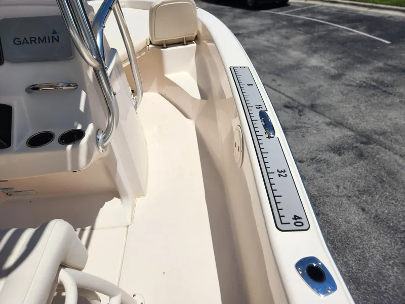 Slide: The Image of 2015 Grady-White 191 Coastal Explorer boat interior with Garmin equipment and measuring scale. - 15