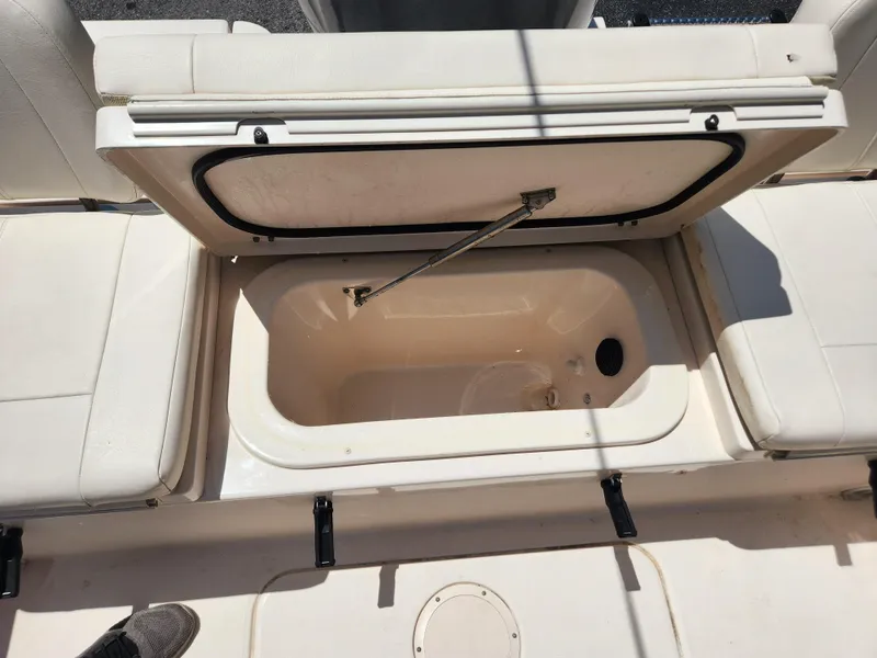 Slide: The Image of 2015 Grady-White 191 Coastal Explorer boat storage compartment open, showing interior. - 17