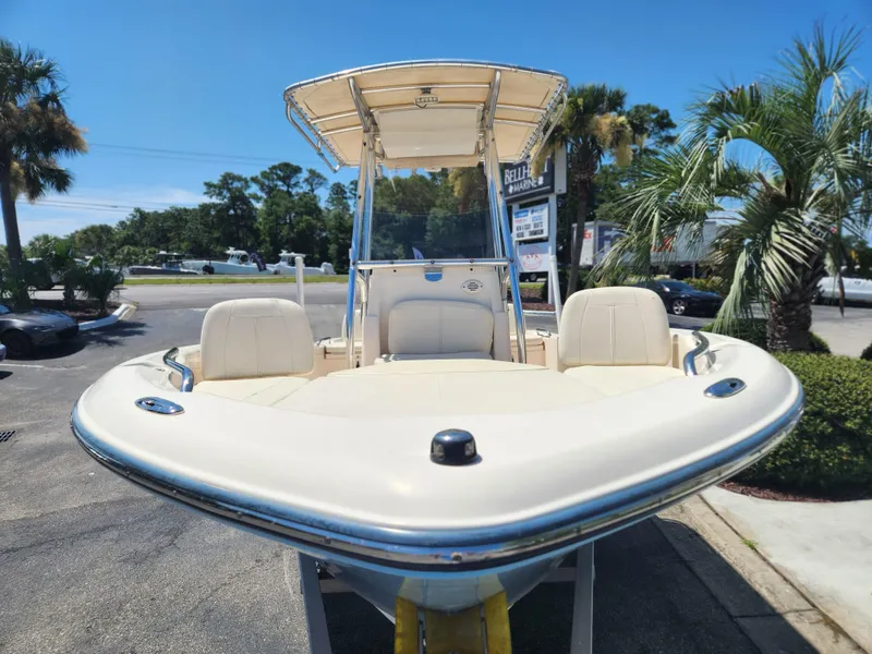Slide: The Image of 2015 Grady-White 191 Coastal Explorer boat displayed outdoors with palm trees. - 6