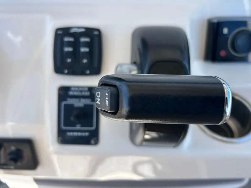 Slide: The Image of Close-up of 2019 Grady-White Fisherman 236 boat control panel with throttle lever. - 15