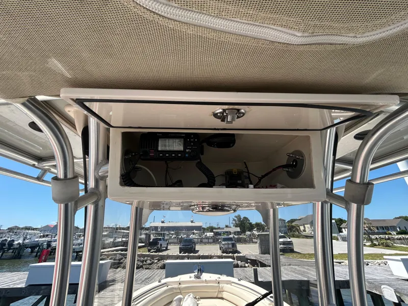 Slide: The Image of 2019 Grady-White Fisherman 236 boat console with electronics, docked at marina. - 18