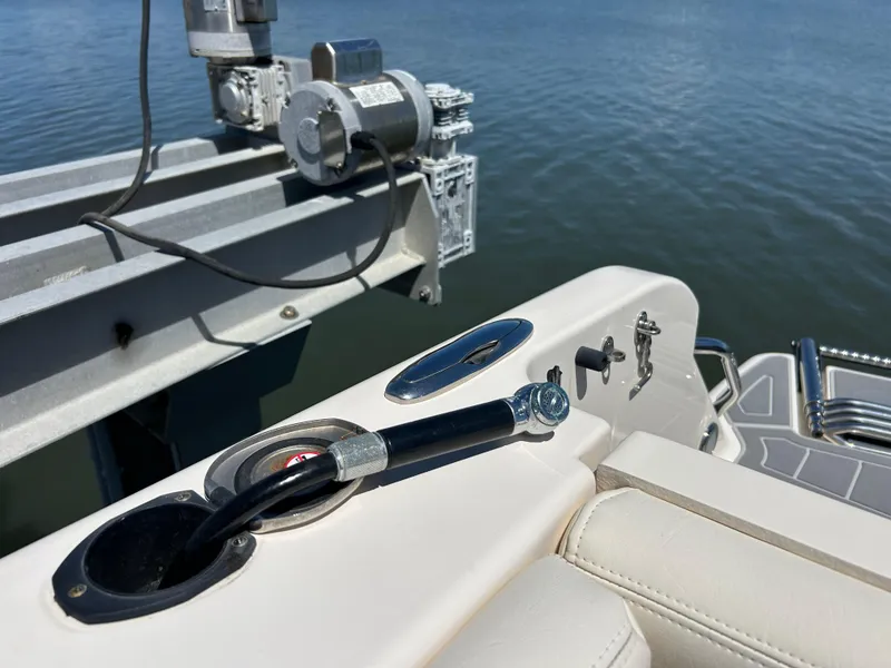 Slide: The Image of 2019 Grady-White Fisherman 236 boat detail with hydraulic lift and water background. - 21