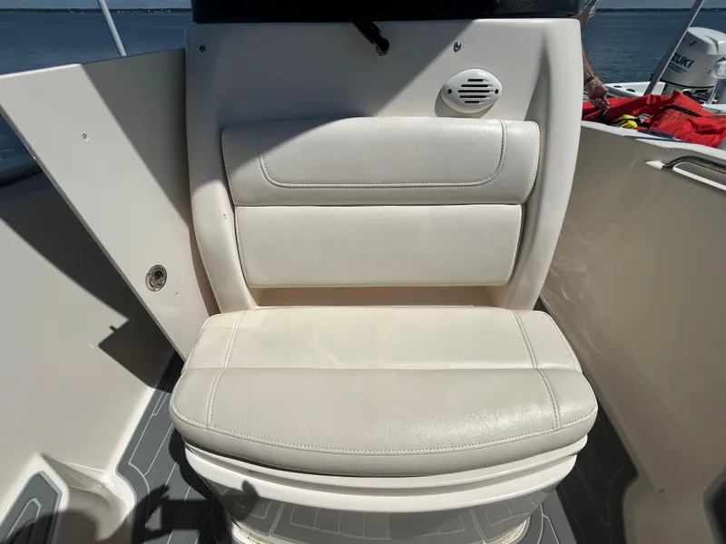 Slide: The Image of 2019 Grady-White Fisherman 236 boat seat, white upholstery, outdoor setting. - 23