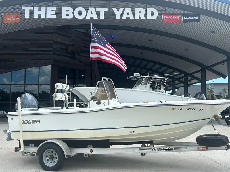 Slide: The Image of 2004 Polar 184 boat on trailer at The Boat Yard with American flag. - 2