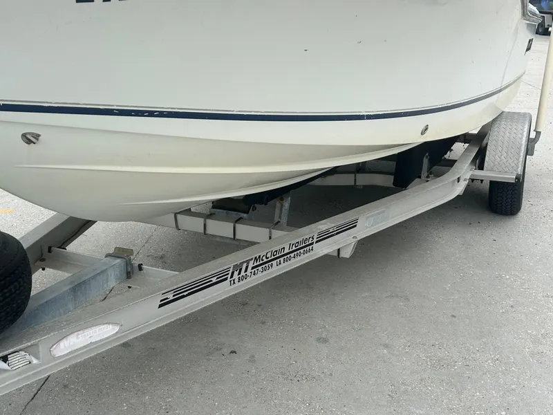 Slide: The Image of Boat on McClain trailer, Polar 184 model, 2004, parked on concrete surface. - 3