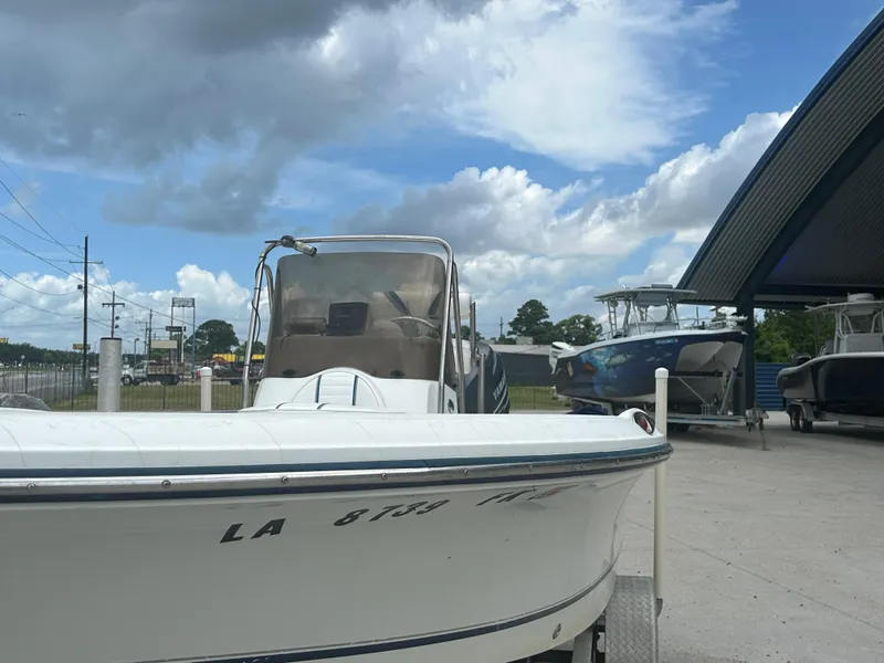 Slide: The Image of 2004 Polar 184 boat on trailer under cloudy sky at dealership. - 5