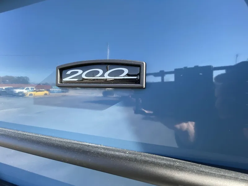 Slide: The Image of Close-up of 2025 South Bay S222 Chill boat emblem on blue surface. - 9