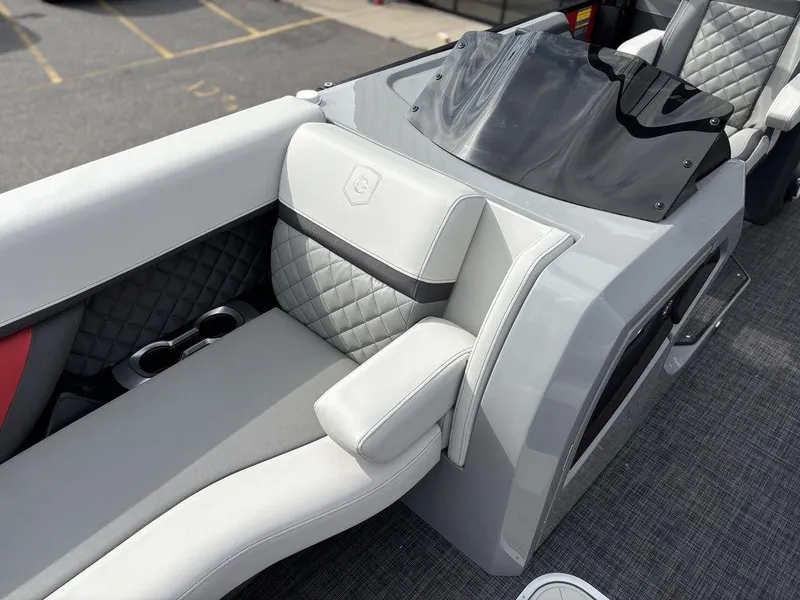Slide: The Image of Luxury seating on 2026 Godfrey AquaPatio 255 ULC boat, featuring quilted upholstery and sleek design. - 10