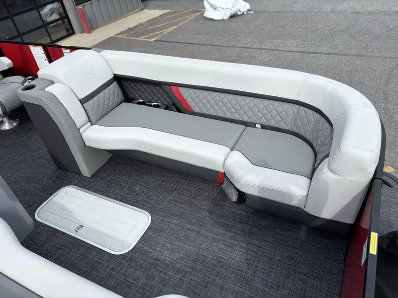 Slide: The Image of Luxurious seating on 2026 Godfrey AquaPatio 255 ULC pontoon boat, featuring quilted upholstery. - 12