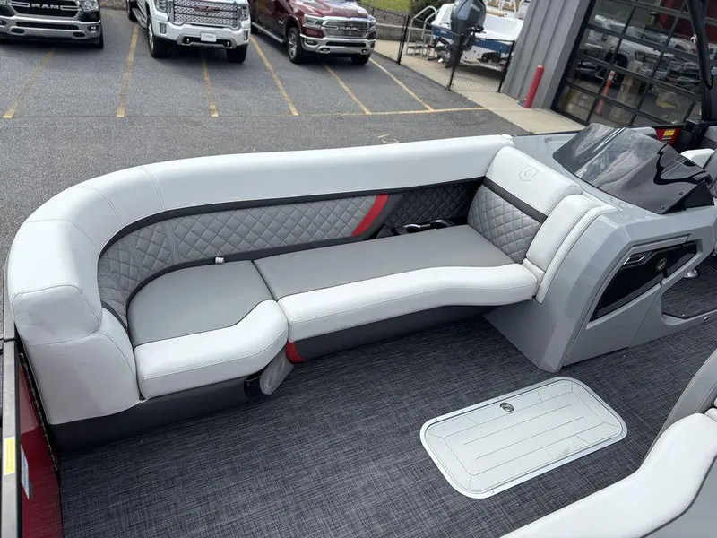 Slide: The Image of Luxurious seating on 2026 Godfrey AquaPatio 255 ULC pontoon boat, featuring quilted upholstery. - 13