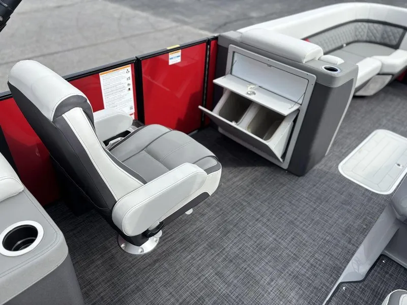 Slide: The Image of 2026 Godfrey AquaPatio 255 ULC interior with gray seating and storage compartments. - 20