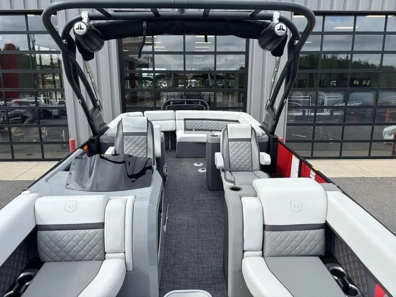 Slide: The Image of 2026 Godfrey AquaPatio 255 ULC pontoon boat with luxurious seating and modern design. - 6