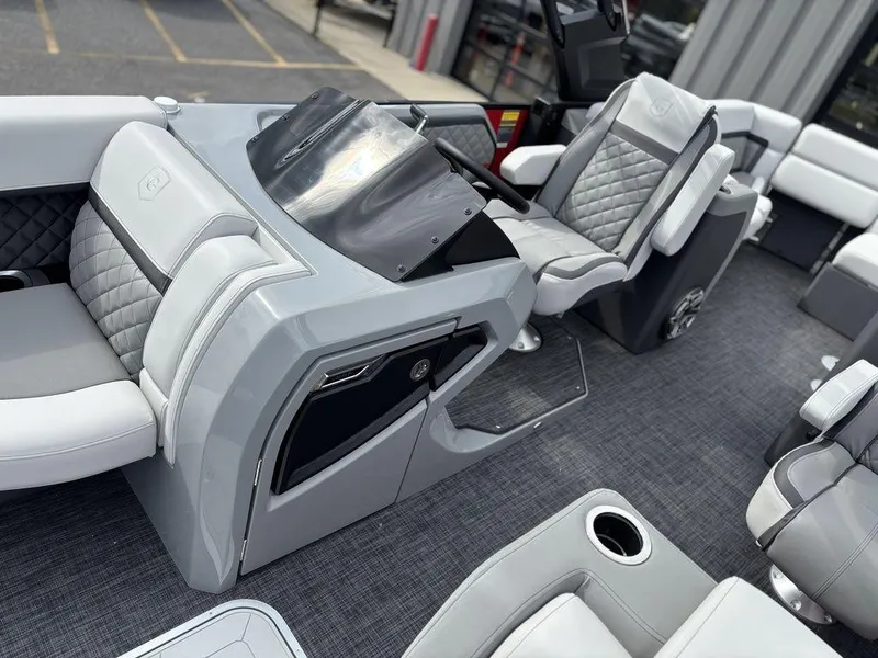 Slide: The Image of Luxurious interior of 2026 Godfrey AquaPatio 255 ULC pontoon boat with plush seating. - 8