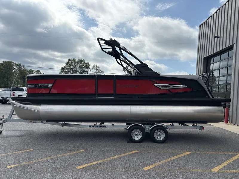 Slide: The Image of 2026 Godfrey AquaPatio 255 ULC pontoon boat on trailer, parked outdoors. - 9