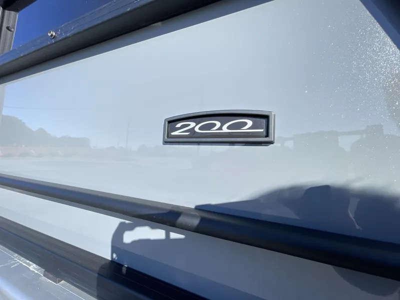 Slide: The Image of Close-up of 2025 South Bay S224RS boat with '200' emblem on sleek exterior. - 11