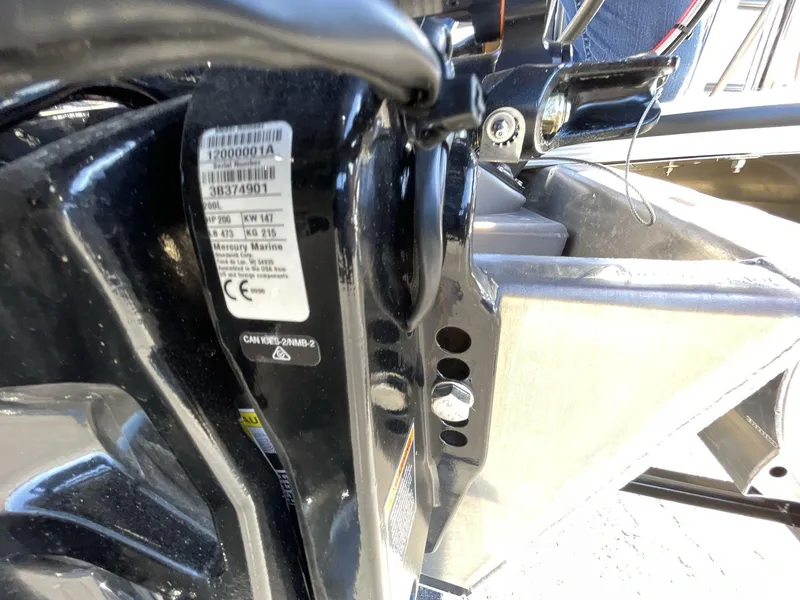 Slide: The Image of Close-up of a 2025 South Bay S224RS boat component with a Mercury Marine label. - 14