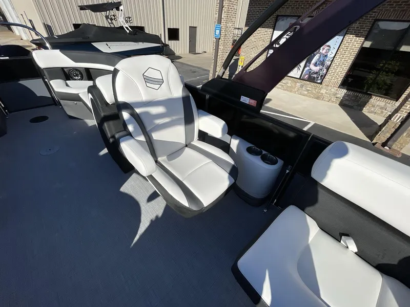 Slide: The Image of 2025 South Bay S224RS boat interior with modern seating and cup holders. - 19