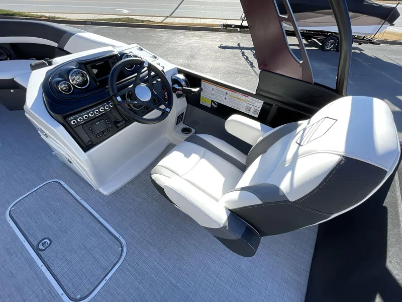 Slide: The Image of 2025 South Bay S224RS boat cockpit with modern steering and comfortable seating. - 20