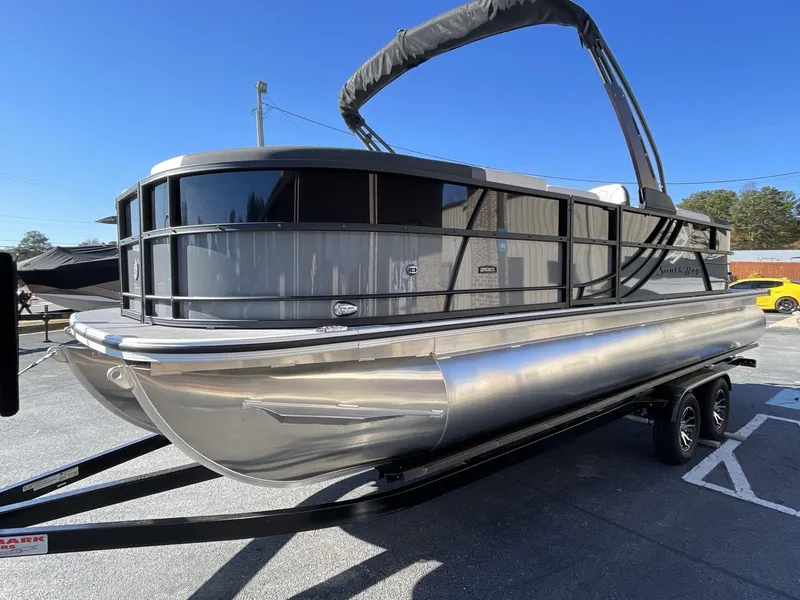 Slide: The Image of 2025 South Bay S224RS pontoon boat on trailer, sleek design, sunny day. - 3