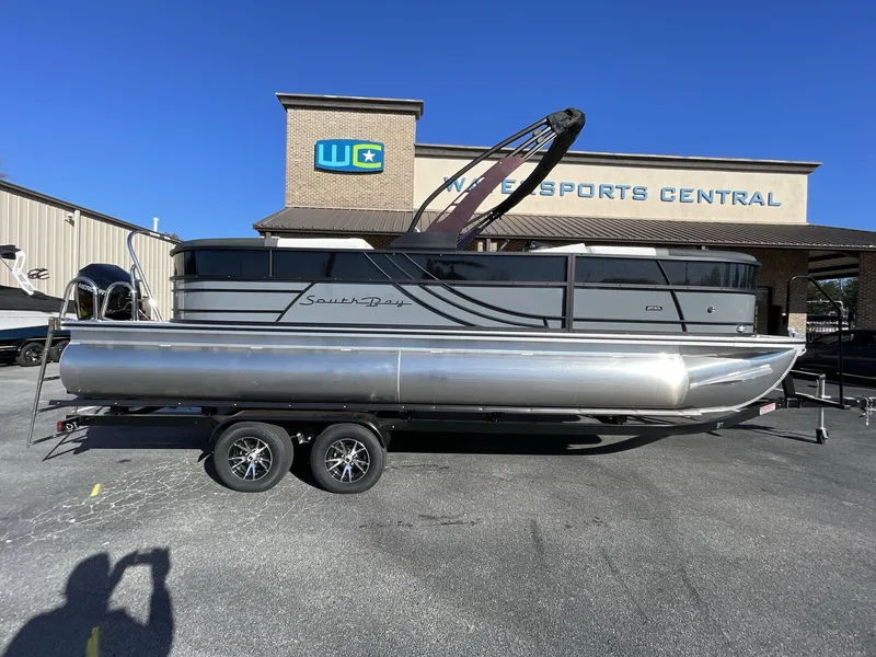 Slide: The Image of 2025 South Bay S224RS pontoon boat on trailer at Watersports Central dealership. - 7